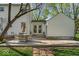 Back patio area with an outdoor table and chairs, perfect for entertaining guests at 2204 Pamela Dr, Indianapolis, IN 46220