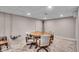 Finished basement featuring a round wooden table with chairs and neutral walls at 2204 Pamela Dr, Indianapolis, IN 46220