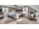 Spacious bedroom with dark wood furniture, a ceiling fan, and plenty of natural light at 2204 Pamela Dr, Indianapolis, IN 46220