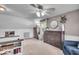 Spacious upstairs bedroom features carpeted floors, ceiling fan, and a window providing natural light at 2204 Pamela Dr, Indianapolis, IN 46220