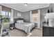 Cozy bedroom with two windows, neutral decor, and a comfortable bed at 2204 Pamela Dr, Indianapolis, IN 46220