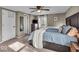 Comfortable bedroom with a ceiling fan, dresser, and a window with natural light at 2204 Pamela Dr, Indianapolis, IN 46220
