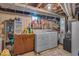 Utility basement area showing a washer and dryer setup with storage cabinets at 2204 Pamela Dr, Indianapolis, IN 46220