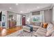 Inviting living room featuring a comfortable sectional, hardwood floors, and neutral paint at 2204 Pamela Dr, Indianapolis, IN 46220