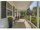 Inviting porch area with comfortable seating, decorative plants, and a welcoming ambiance at 2204 Pamela Dr, Indianapolis, IN 46220