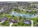 Bird's eye view of the community highlighting the picturesque pond and well-maintained landscaping at 2446 Quiet Way, Indianapolis, IN 46239