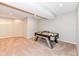 Finished basement featuring an air hockey table at 2446 Quiet Way, Indianapolis, IN 46239