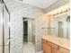 Bathroom featuring a vanity, mirror, and shower-tub combination at 2446 Quiet Way, Indianapolis, IN 46239