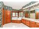 Large bathroom with a soaking tub, vanity, and wood-framed windows at 2446 Quiet Way, Indianapolis, IN 46239