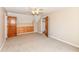 Bedroom featuring a ceiling fan, carpet, built-in storage and access to the ensuite at 2446 Quiet Way, Indianapolis, IN 46239
