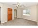 Bedroom featuring a ceiling fan, carpet, and a window offering natural light at 2446 Quiet Way, Indianapolis, IN 46239