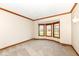Carpeted living room with a bay window providing natural light at 2446 Quiet Way, Indianapolis, IN 46239