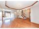 Open floor plan, hardwood floors, and a staircase at 2446 Quiet Way, Indianapolis, IN 46239