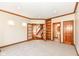Open living room with carpeted floors and doorway to another room at 2446 Quiet Way, Indianapolis, IN 46239