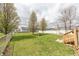 Spacious backyard featuring a deck, picnic table, and swing set at 282 N Mapleton St, Columbus, IN 47201