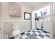 Bathroom with blue checkered floors, white wood-panel walls, and features a laundry room at 282 N Mapleton St, Columbus, IN 47201
