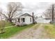 Exterior elevation of house, including a covered front porch and a detached garage at 282 N Mapleton St, Columbus, IN 47201