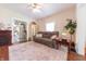 Inviting living room with hardwood floors, decorative fireplace, and access to the kitchen, creating a welcoming space at 282 N Mapleton St, Columbus, IN 47201