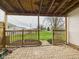 Covered outdoor patio with paver flooring looking out to a green lawn at 301 E 34Th St, Anderson, IN 46013