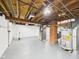 Unfinished basement featuring exposed ductwork, a water heater, and a brick support column at 301 E 34Th St, Anderson, IN 46013