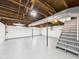 Spacious unfinished basement with concrete floor and exposed ceiling with duct work at 301 E 34Th St, Anderson, IN 46013