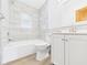 Clean bathroom featuring white cabinets, a shower-tub, and modern fixtures at 301 E 34Th St, Anderson, IN 46013
