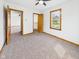 Bright bedroom with neutral carpet and a spacious closet at 301 E 34Th St, Anderson, IN 46013