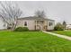 Charming single-story home with a well-maintained lawn and walkway leading to the front door at 301 E 34Th St, Anderson, IN 46013