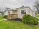 Charming single-story home with a well-maintained lawn and walkway leading to the front door at 301 E 34Th St, Anderson, IN 46013