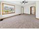 Bright living room featuring neutral carpet, a large picture window, and an open entryway at 301 E 34Th St, Anderson, IN 46013