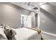 Neutral-colored bedroom features soft carpeting and natural light coming through the windows and ceiling fan at 3031 Nowland Ave, Indianapolis, IN 46201