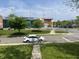 Street view featuring modern building with interesting architectural design, a bicycle, and well-kept landscaping at 3031 Nowland Ave, Indianapolis, IN 46201