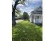 Charming home with a well-maintained front lawn and a classic front porch at 3031 Nowland Ave, Indianapolis, IN 46201