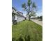Manicured front lawn with a large shade tree and a sidewalk to the street at 3031 Nowland Ave, Indianapolis, IN 46201