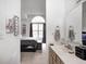 Bathroom connected to a bedroom with a single sink, faucet, and a hanging hand towel at 3051 Firestone Cir, Indianapolis, IN 46234
