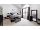 Inviting bedroom with a large window, plush carpet, and plenty of natural light at 3051 Firestone Cir, Indianapolis, IN 46234