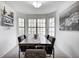 Elegant dining room featuring a modern table set, neutral walls, and natural light at 3051 Firestone Cir, Indianapolis, IN 46234