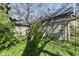 The exterior view captures the building's framework, lush greenery, and ongoing construction, emphasizing its potential and natural setting at 324 E Burgess Ave, Indianapolis, IN 46219