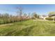 Large backyard with a mix of grass and wildflowers at 3255 W 30Th St, Indianapolis, IN 46222