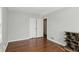 Neutral bedroom with hardwood floors features double closets for ample storage space at 3255 W 30Th St, Indianapolis, IN 46222