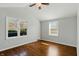 Charming bedroom with hardwood floors, vaulted ceilings, and windows providing natural light at 3255 W 30Th St, Indianapolis, IN 46222
