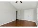 This bedroom features hardwood floors, a ceiling fan and a large closet for storage at 3255 W 30Th St, Indianapolis, IN 46222