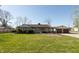 Charming single-story home with a well-maintained lawn and attached two-car garage at 3255 W 30Th St, Indianapolis, IN 46222