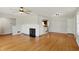 Cozy living room featuring hardwood floors, a classic fireplace and built-in shelving at 3255 W 30Th St, Indianapolis, IN 46222