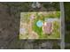 Aerial view of the property highlighting a spacious lot, pool, and well-maintained landscaping at 3331 Daniel St, Mooresville, IN 46158