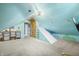 Playful attic with a rock climbing wall, slide, and muraled walls, perfect for  at 3331 Daniel St, Mooresville, IN 46158