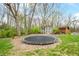 Spacious backyard with a trampoline and sheds surrounded by mature trees at 3331 Daniel St, Mooresville, IN 46158