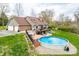 Lush backyard featuring an above ground pool, deck, and ample space for outdoor activities at 3331 Daniel St, Mooresville, IN 46158