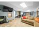 Finished basement with a comfortable seating area, fireplace, and natural light at 3331 Daniel St, Mooresville, IN 46158