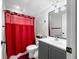 Modern bathroom featuring updated fixtures, a vanity, and a red shower curtain at 3331 Daniel St, Mooresville, IN 46158
